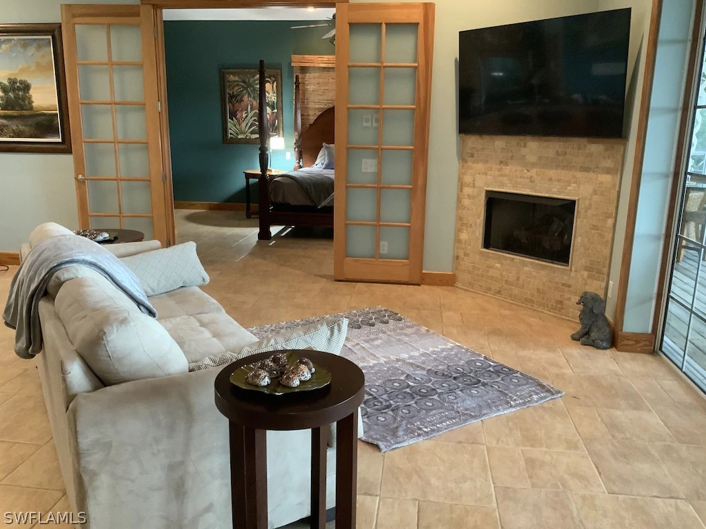 7231 Pineland Road Bokeelia, FL 33922 - Photo 10 of 24 a living room with furniture and a fireplace