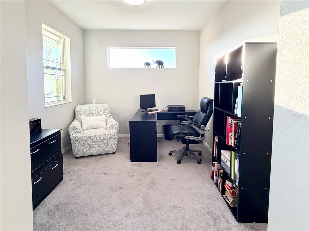 3105 Trustee Avenue Sarasota, FL 34243 - Photo 13 of 19 a living room with furniture and a flat screen tv