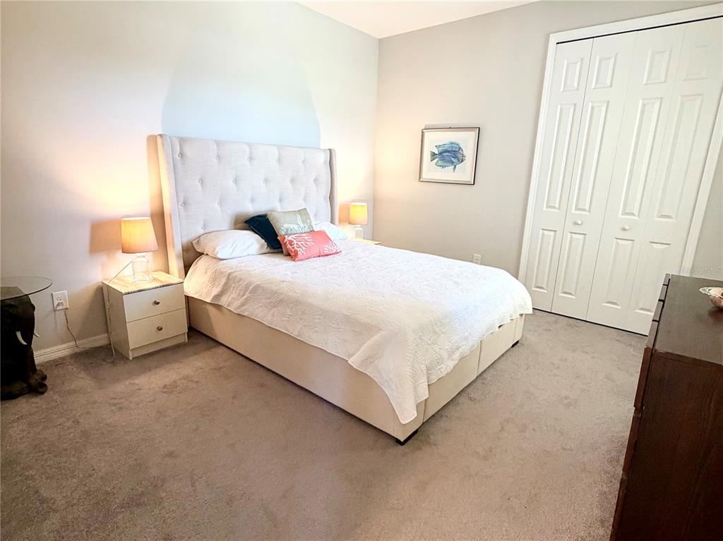 3105 Trustee Avenue Sarasota, FL 34243 - Photo 14 of 19 a bedroom with a bed and a lamp