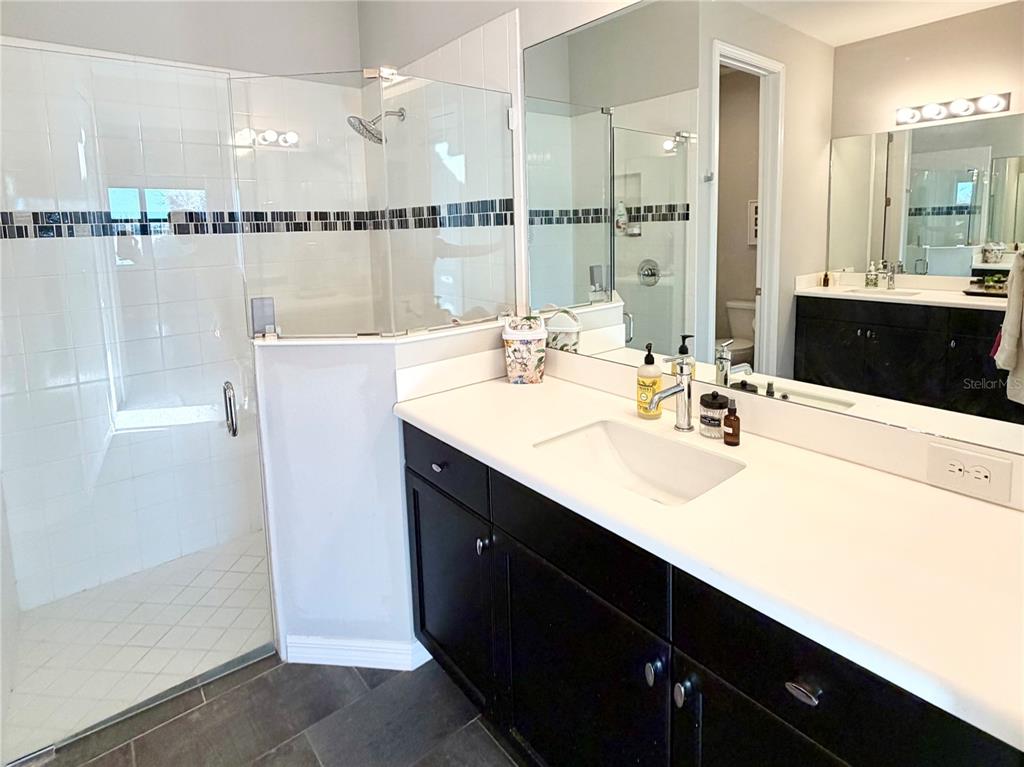 3105 Trustee Avenue Sarasota, FL 34243 - Photo 15 of 19 a bathroom with a sink double vanity and a mirror