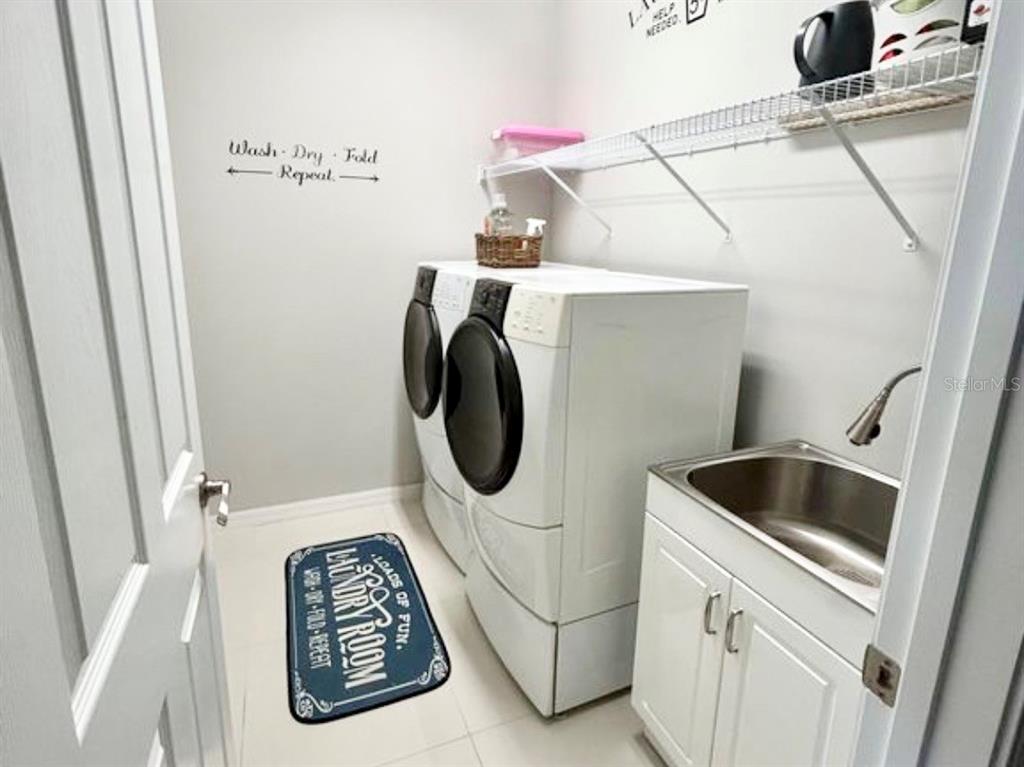 3105 Trustee Avenue Sarasota, FL 34243 - Photo 17 of 19 a utility room with dryer and washer