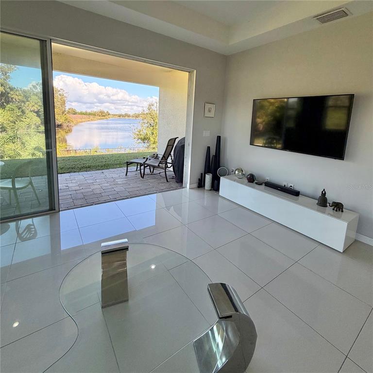 3105 Trustee Avenue Sarasota, FL 34243 - Photo 7 of 14 a living room with furniture and a flat screen tv