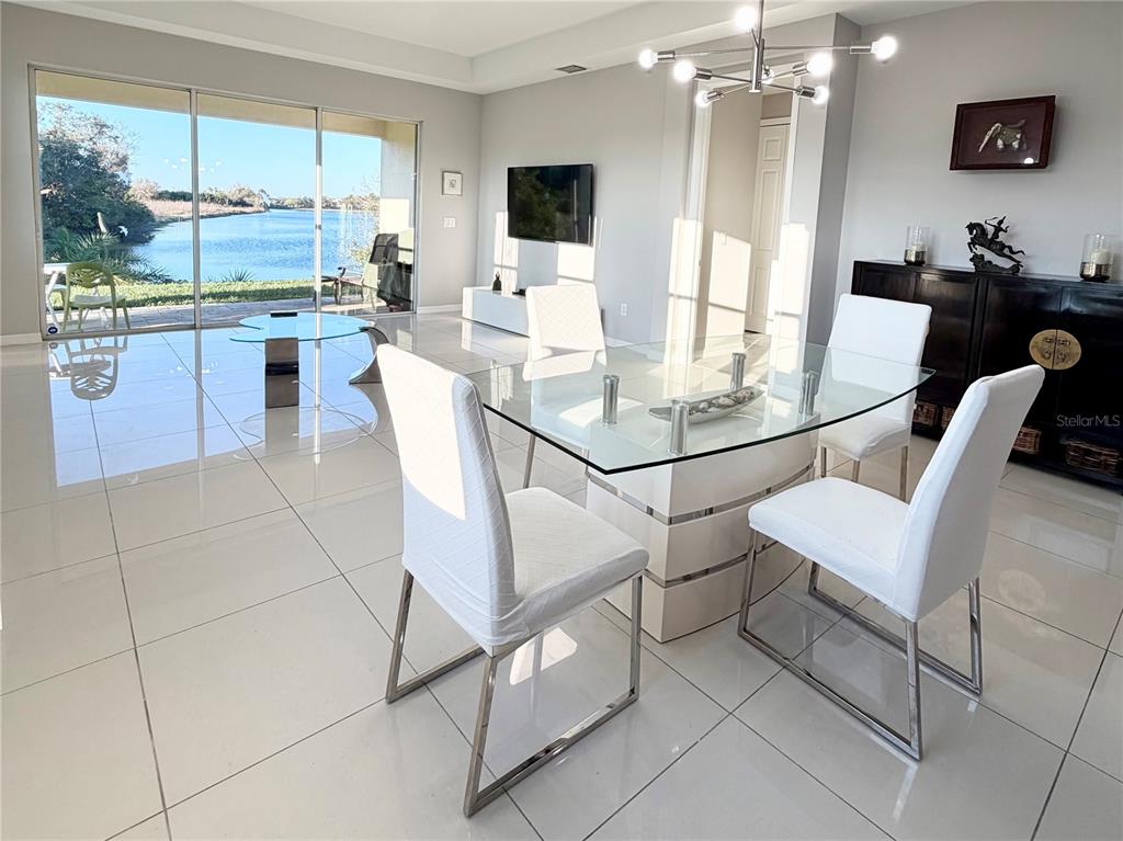 3105 Trustee Avenue Sarasota, FL 34243 - Photo 7 of 19 a view of a dining room with furniture window and outside view