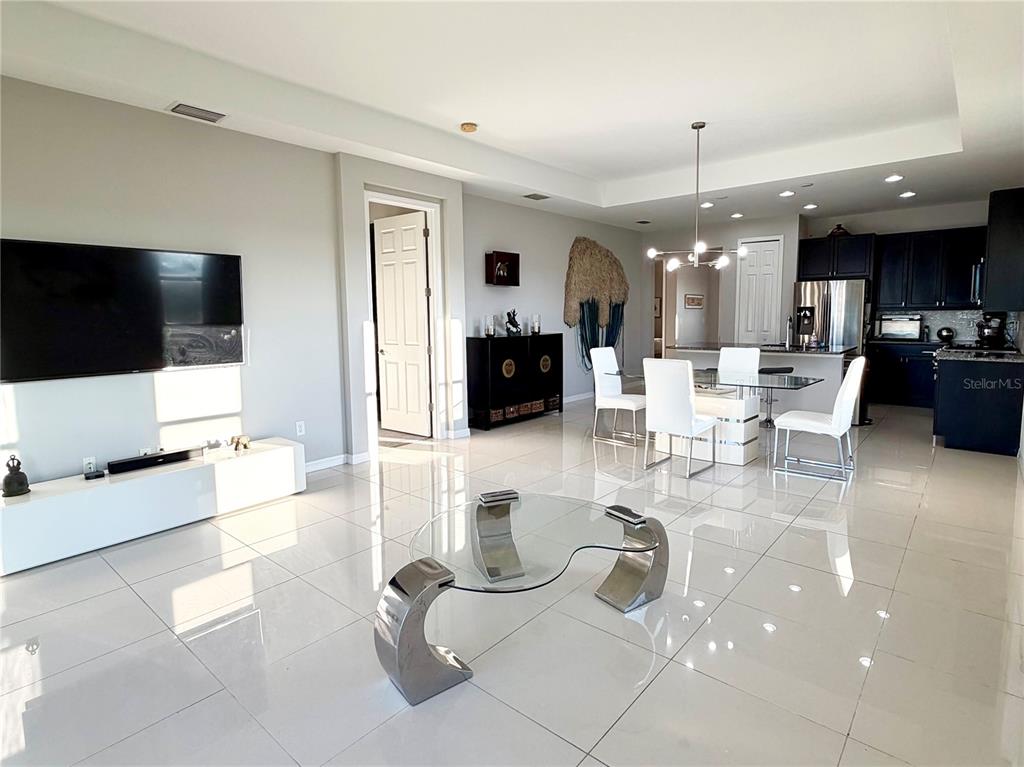 3105 Trustee Avenue Sarasota, FL 34243 - Photo 8 of 19 a living room with furniture and a flat screen tv