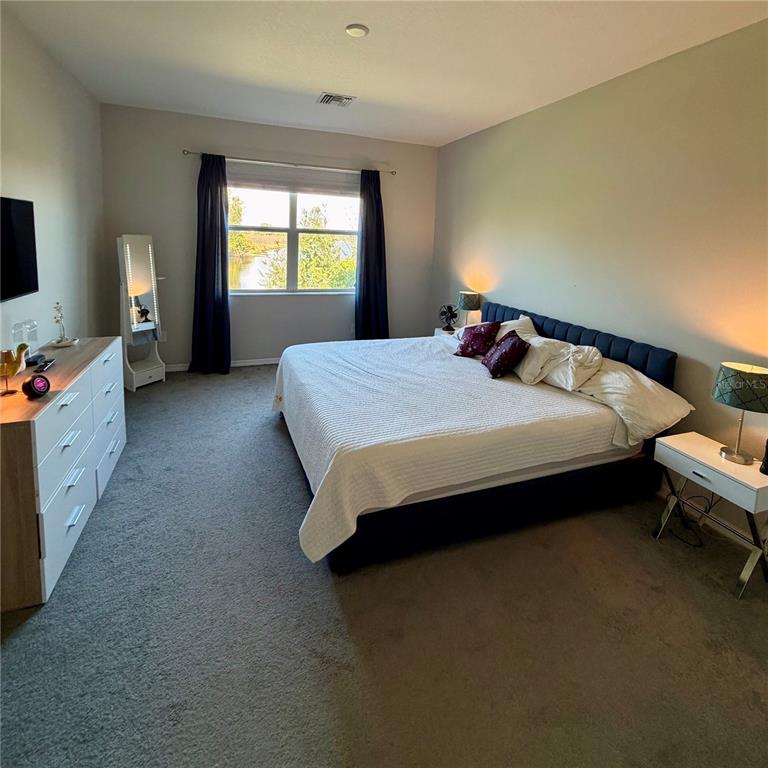 3105 Trustee Avenue Sarasota, FL 34243 - Photo 8 of 14 a bedroom with a bed and a window