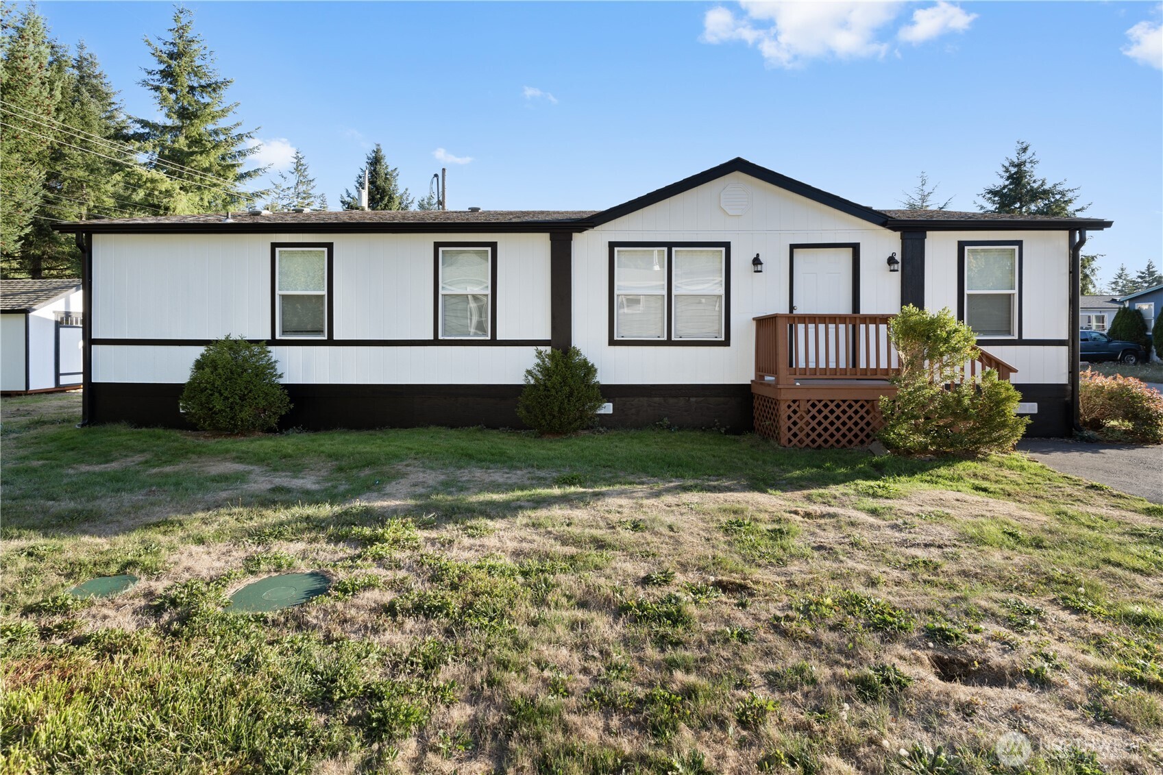 10324 Delphi Road Southwest, Unit 17 Olympia, WA 98512 - Photo 2 of 24 a front view of a house with garden