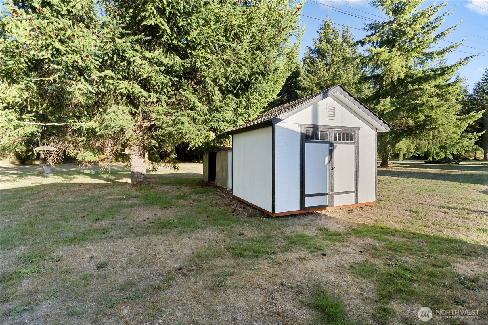 10324 Delphi Road Southwest, Unit 17 Olympia, WA 98512 - Photo 22 of 24 a view of a house with a yard