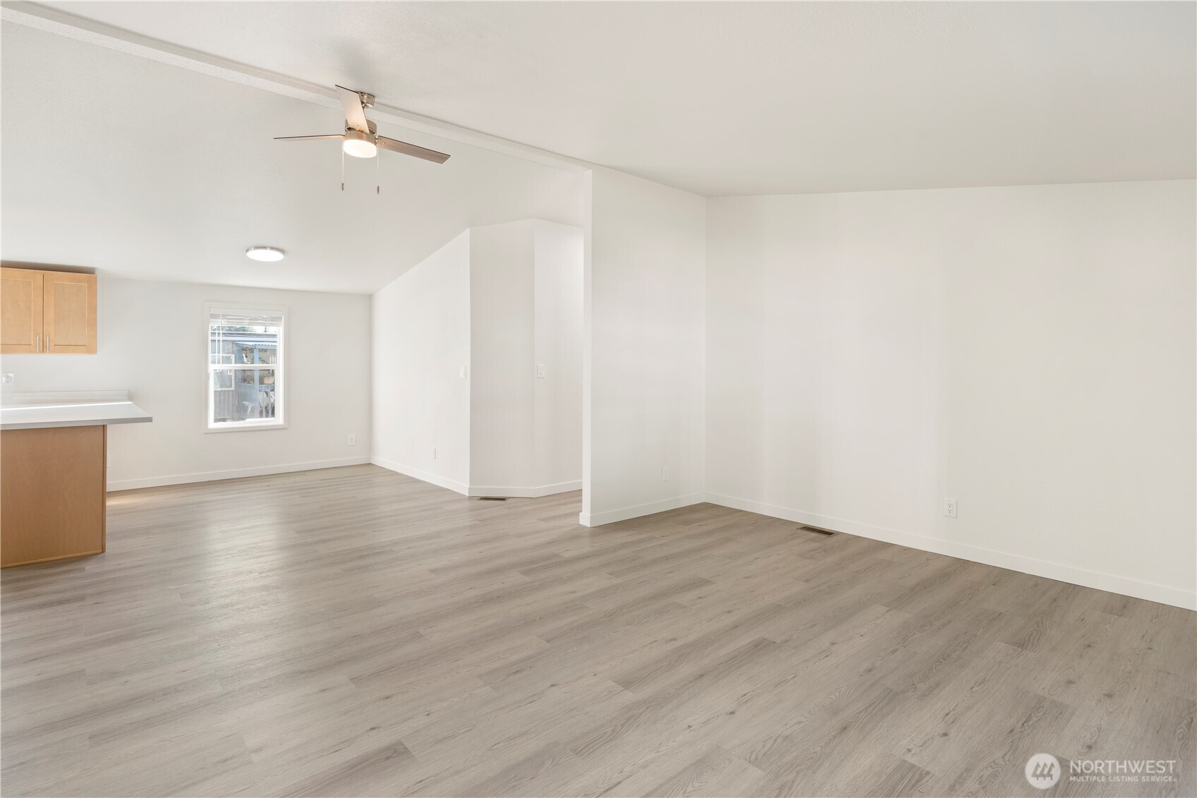 10324 Delphi Road Southwest, Unit 17 Olympia, WA 98512 - Photo 5 of 24 wooden floor in an empty room with a window