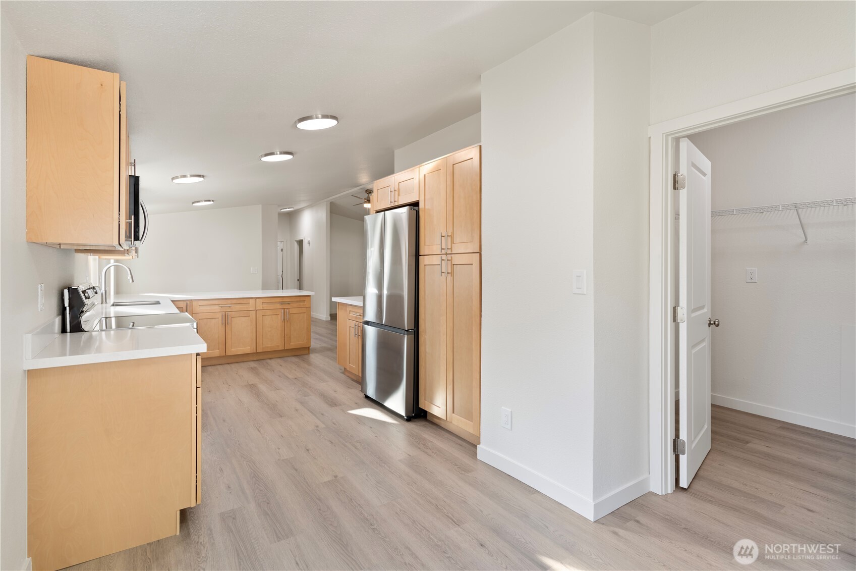 10324 Delphi Road Southwest, Unit 17 Olympia, WA 98512 - Photo 8 of 24 a view of a kitchen with a refrigerator a sink and a refrigerator