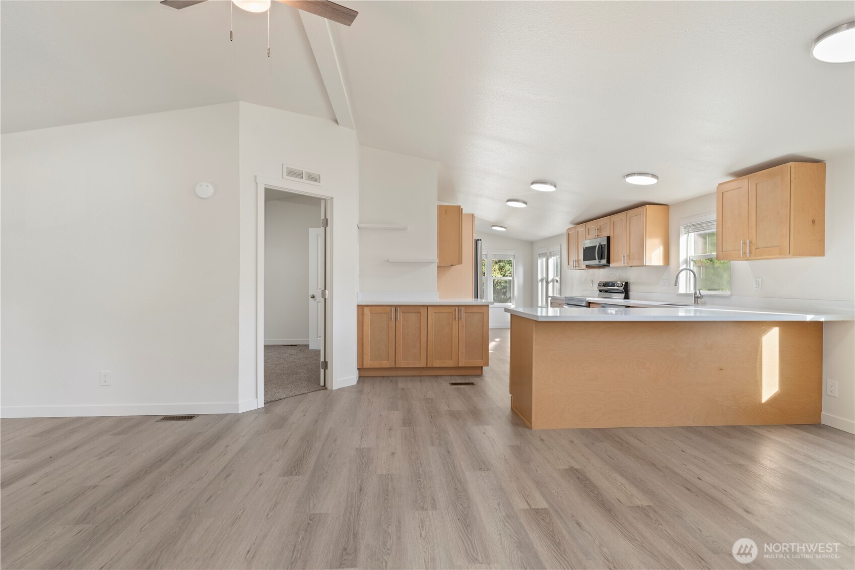 10324 Delphi Road Southwest, Unit 17 Olympia, WA 98512 - Photo 9 of 24 a view of kitchen with wooden floor