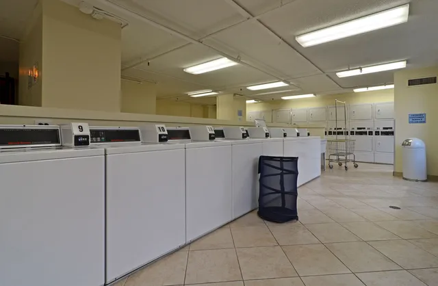 a room with stainless steel appliances lots of counter top space