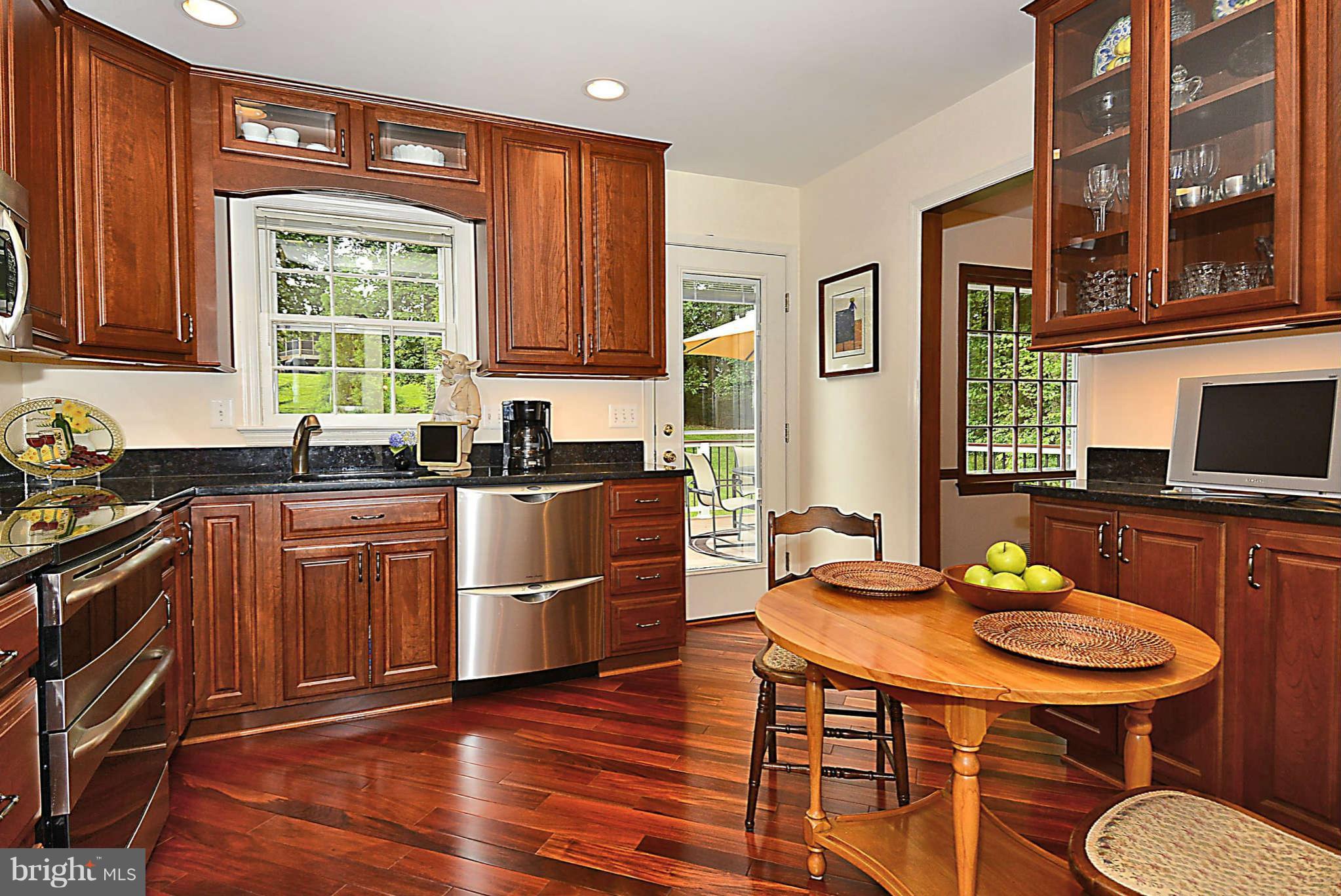 8229 Hilton Road Gaithersburg, MD 20882 - Photo 13 of 30 Kitchen to Dining Room and Deck Access