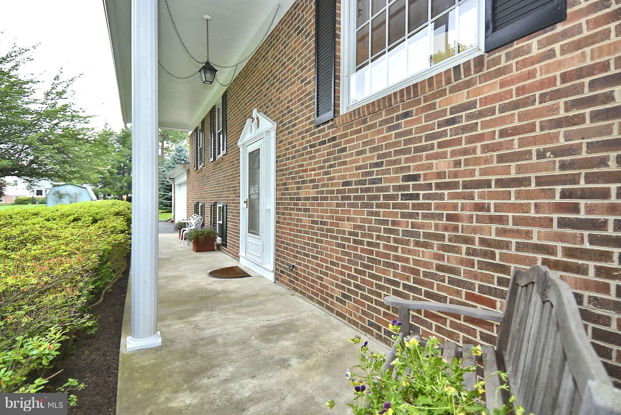 8229 Hilton Road Gaithersburg, MD 20882 - Photo 3 of 30 Covered Front Porch Beckons Relaxed Living