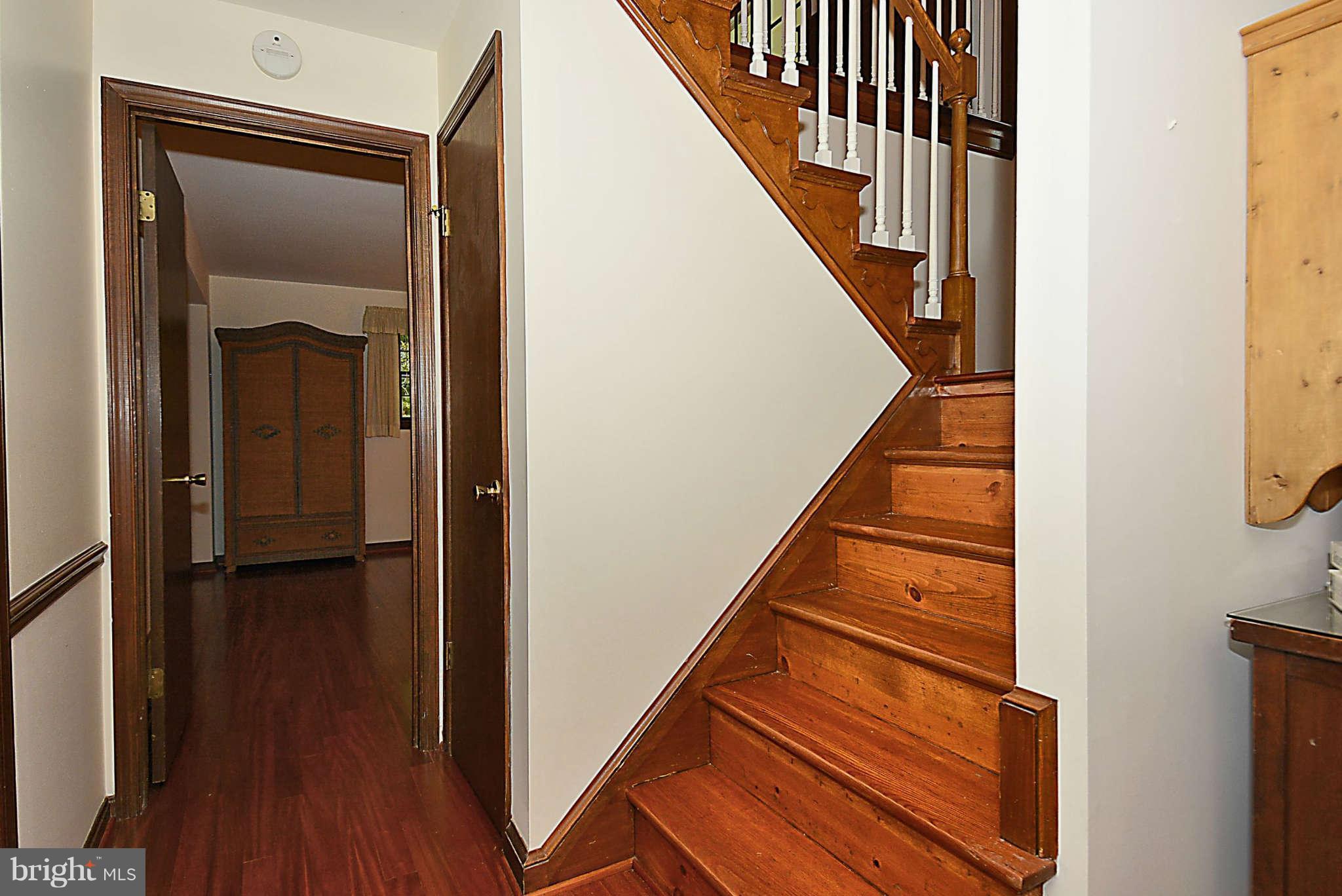8229 Hilton Road Gaithersburg, MD 20882 - Photo 21 of 30 Stairs from Foyer to Lower Level