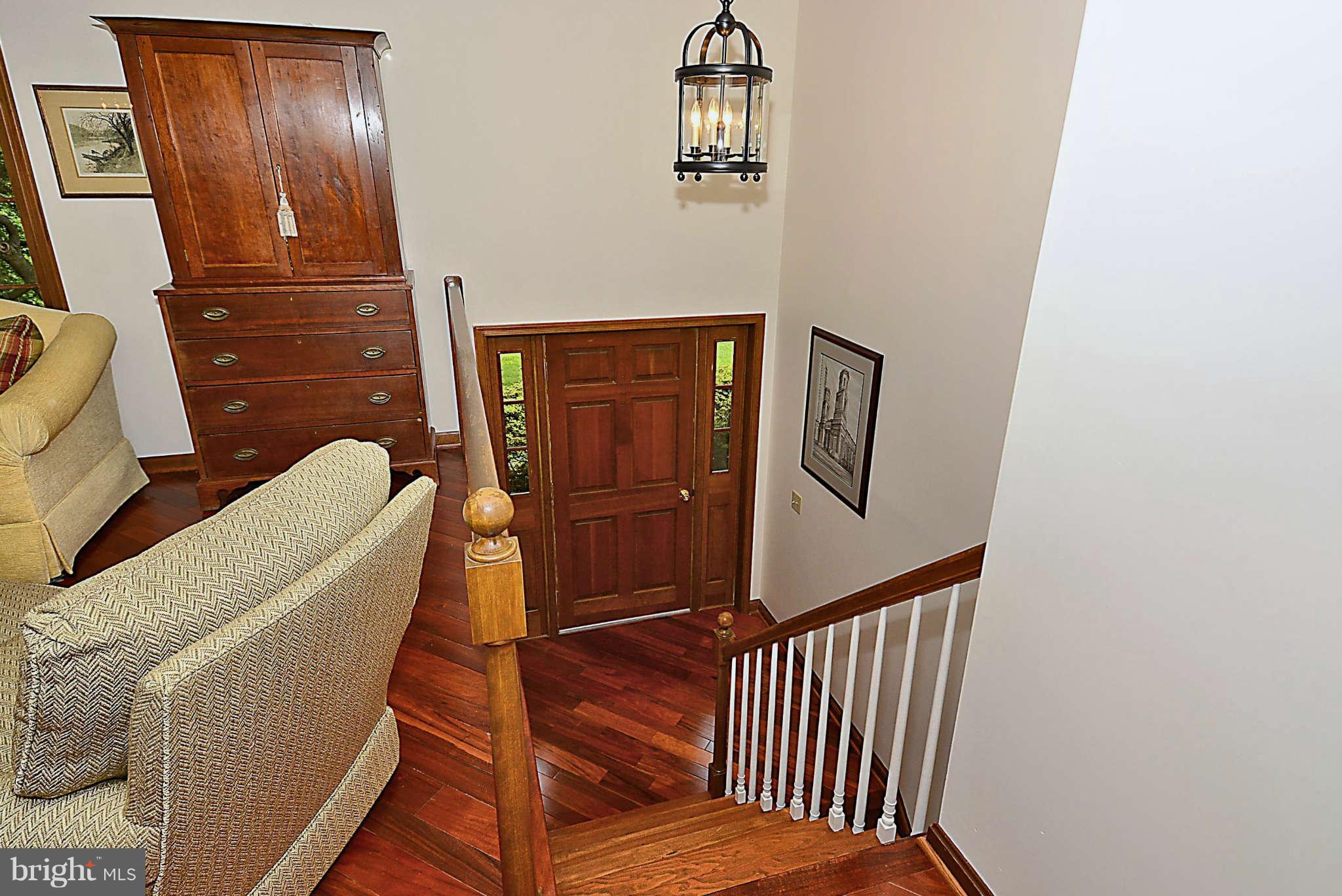 8229 Hilton Road Gaithersburg, MD 20882 - Photo 4 of 30 Spacious Foyer with Warm Wood Highlights