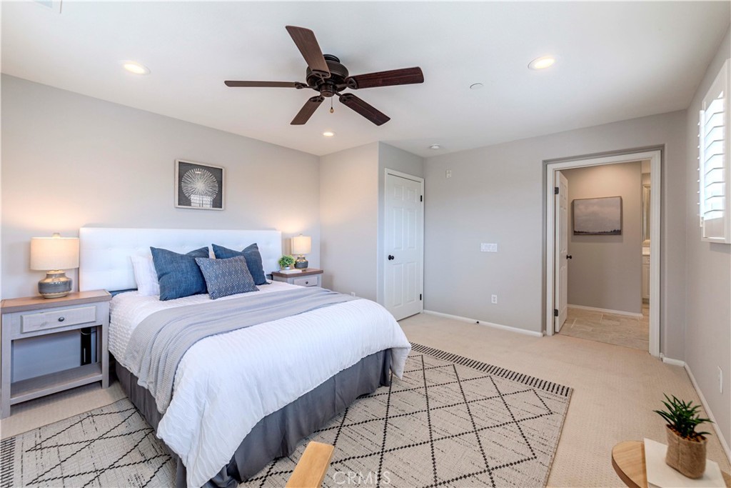 140 Full Moon Irvine, CA 92618 - Photo 20 of 38 a bedroom with a bed and a lamp