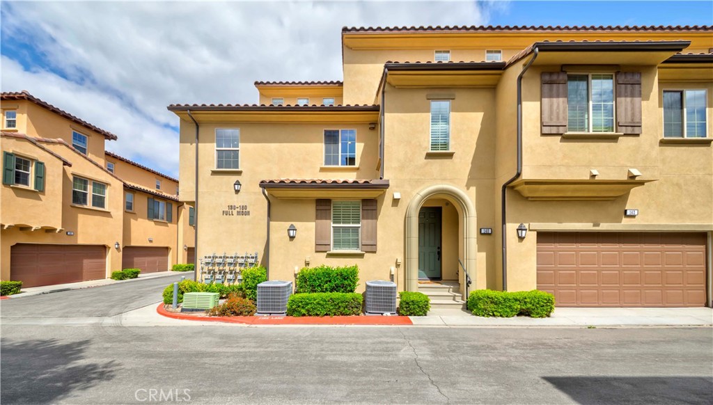 140 Full Moon Irvine, CA 92618 - Photo 2 of 38 a front view of a multi story residential apartment building