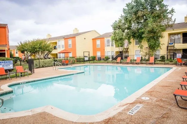a view of a swimming pool with a lounge chairs