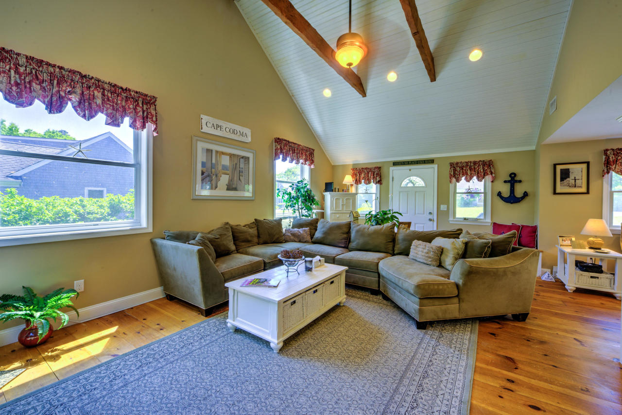 22 Chase Road Edgartown, MA 02539 - Photo 12 of 35 a living room with furniture and a large window