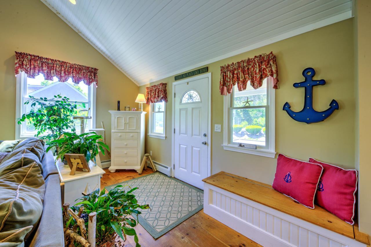 22 Chase Road Edgartown, MA 02539 - Photo 13 of 35 a living room with furniture and a potted plant