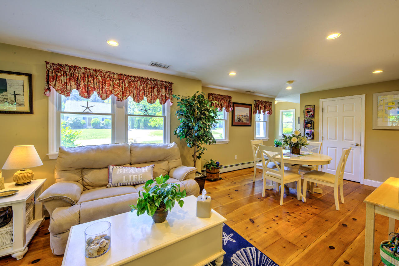 22 Chase Road Edgartown, MA 02539 - Photo 16 of 35 a living room with furniture and a large window