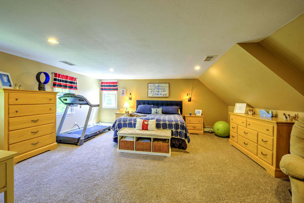 22 Chase Road Edgartown, MA 02539 - Photo 23 of 35 a bed room with a bed and a couch