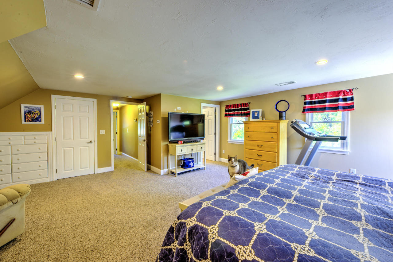 22 Chase Road Edgartown, MA 02539 - Photo 24 of 35 a bedroom with a bed and flat screen tv