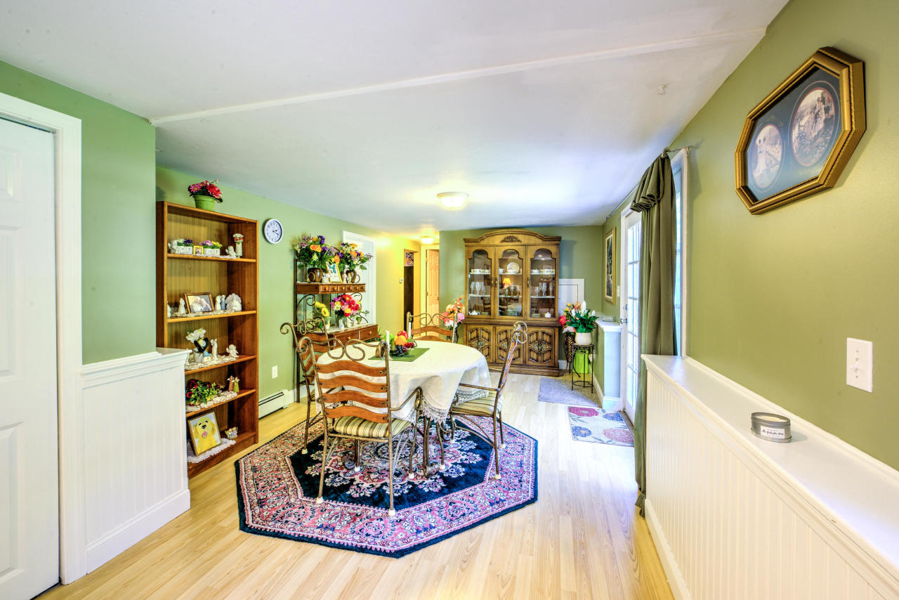 22 Chase Road Edgartown, MA 02539 - Photo 29 of 35 a living room with furniture and a wooden floor