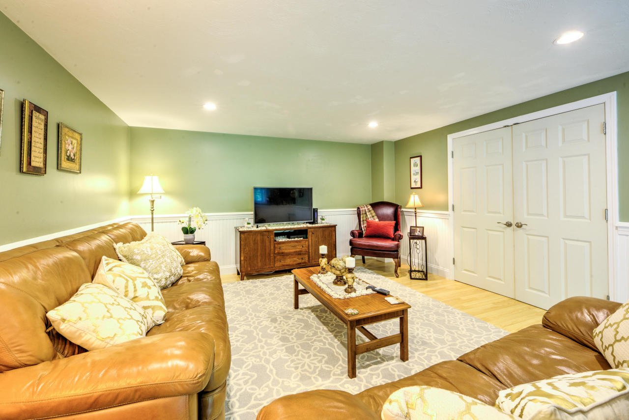 22 Chase Road Edgartown, MA 02539 - Photo 33 of 35 a living room with furniture and a flat screen tv