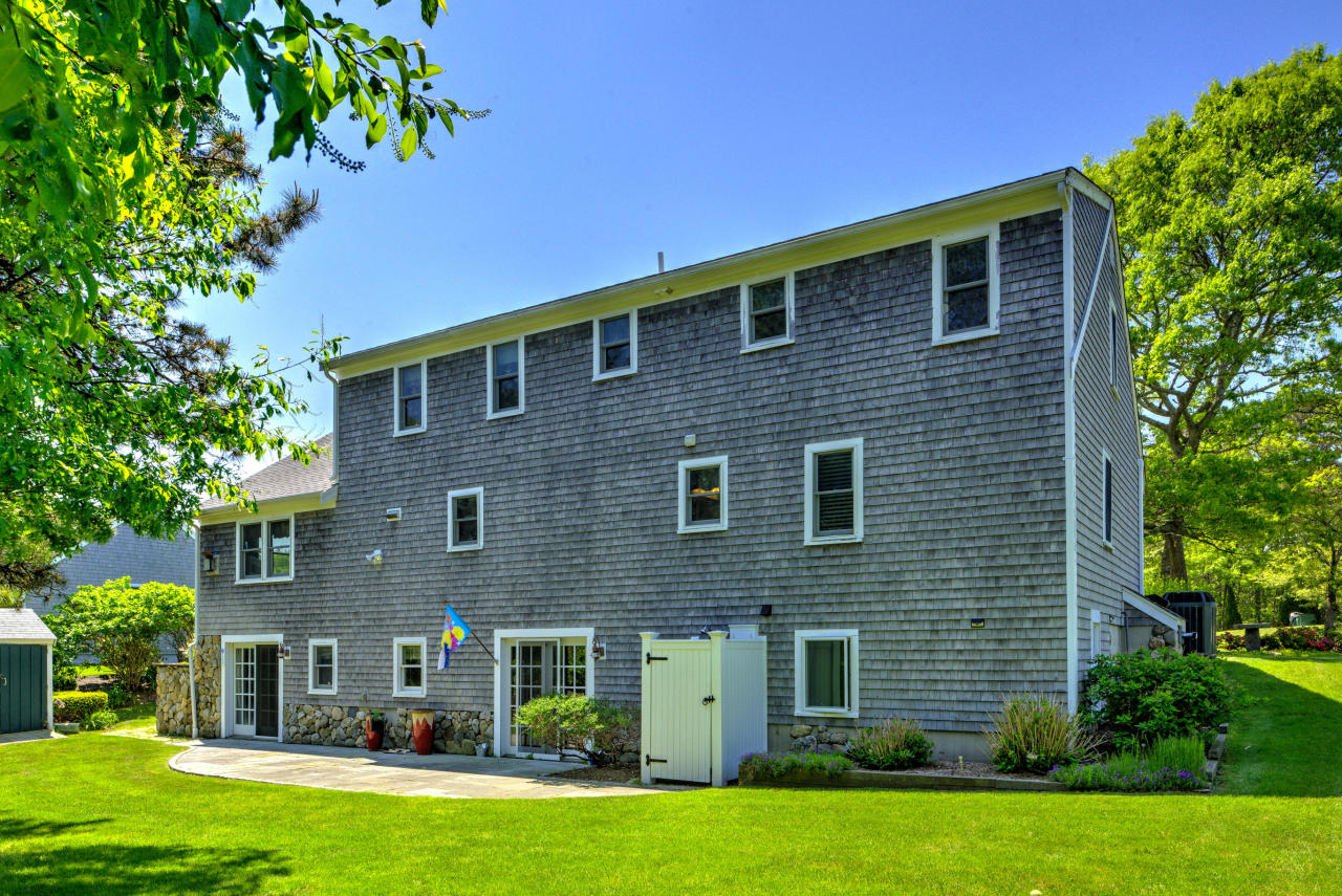 22 Chase Road Edgartown, MA 02539 - Photo 4 of 35 a front view of a house with a garden