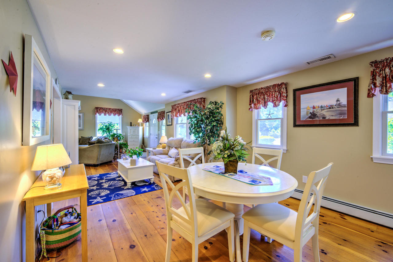 22 Chase Road Edgartown, MA 02539 - Photo 8 of 35 a view of a dining room with furniture window and wooden floor