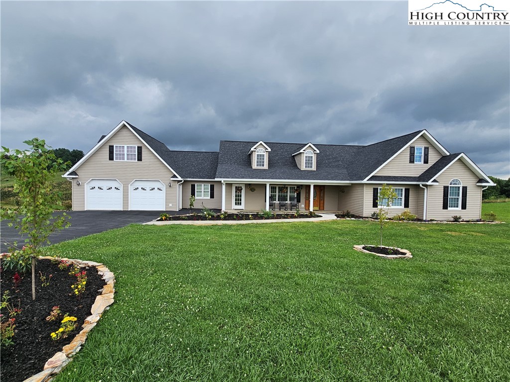 611 Barrett Road Ennice, NC 28623 - Photo 1 of 45 a front view of a house with a yard