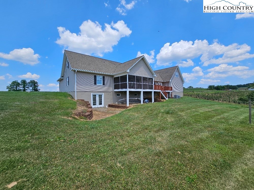 611 Barrett Road Ennice, NC 28623 - Photo 11 of 45 a front view of a house with garden