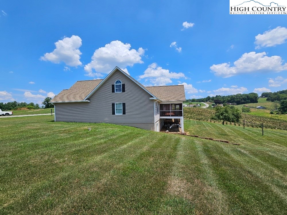 611 Barrett Road Ennice, NC 28623 - Photo 12 of 45 a front view of a house with garden