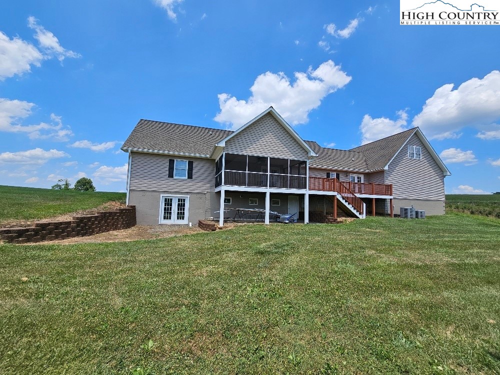 611 Barrett Road Ennice, NC 28623 - Photo 13 of 45 a front view of a house with a garden