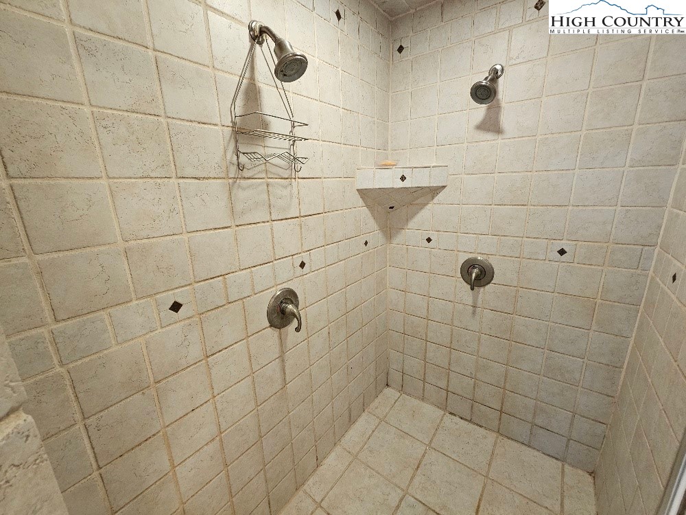 611 Barrett Road Ennice, NC 28623 - Photo 29 of 45 a bathroom with a shower