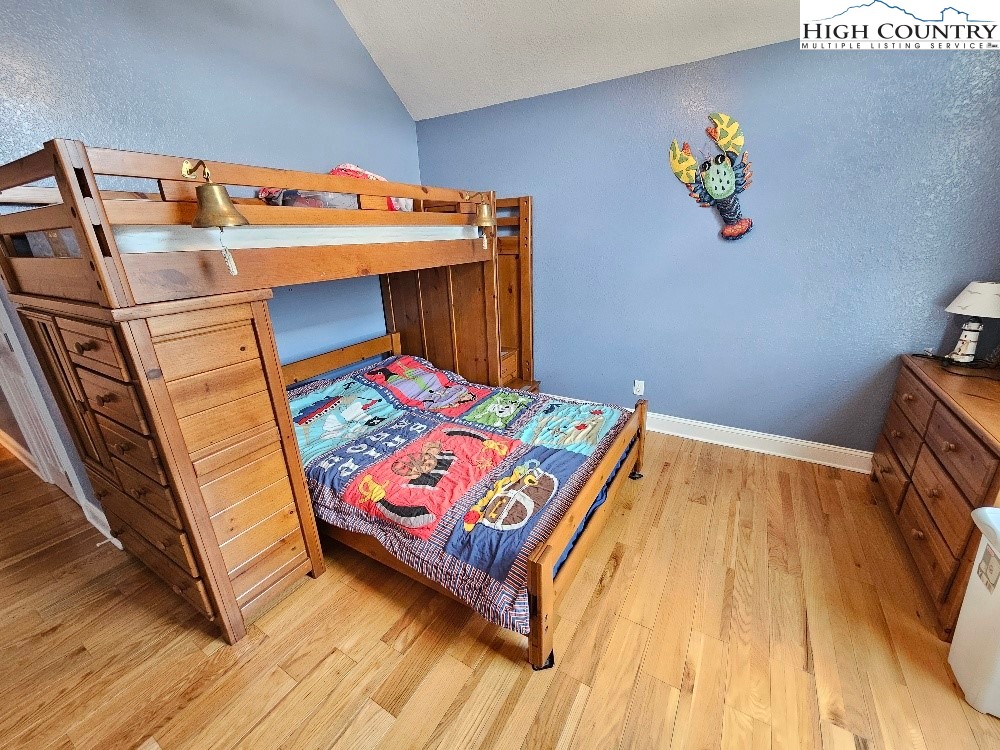 611 Barrett Road Ennice, NC 28623 - Photo 31 of 45 a bedroom with a bed and a dresser