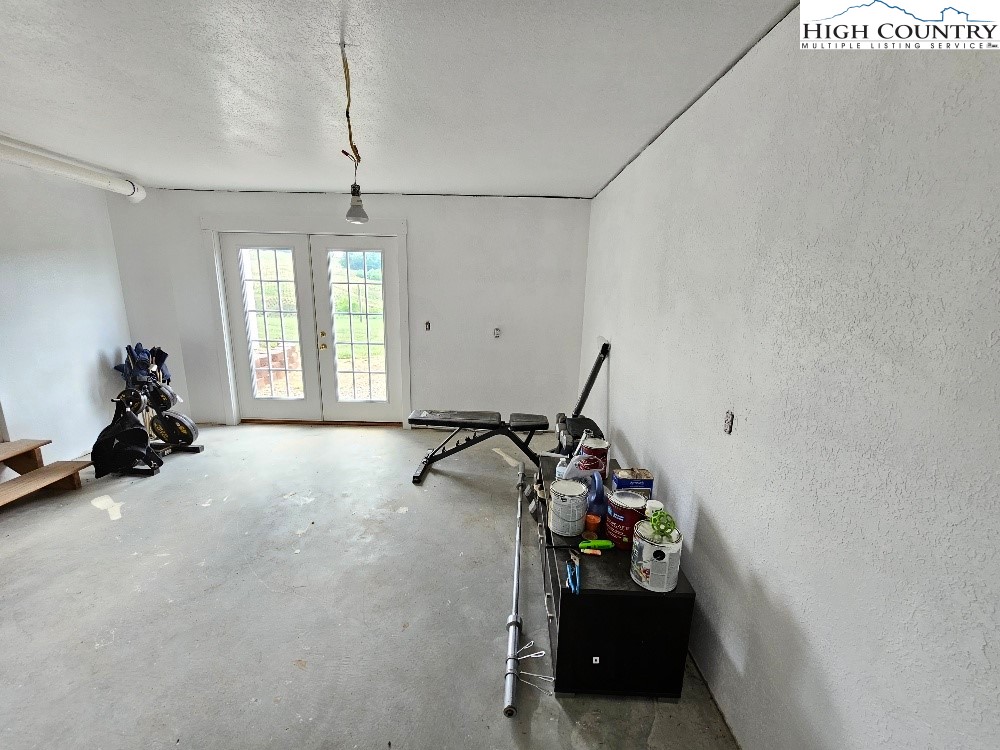 611 Barrett Road Ennice, NC 28623 - Photo 38 of 45 a view of a room with gym equipment