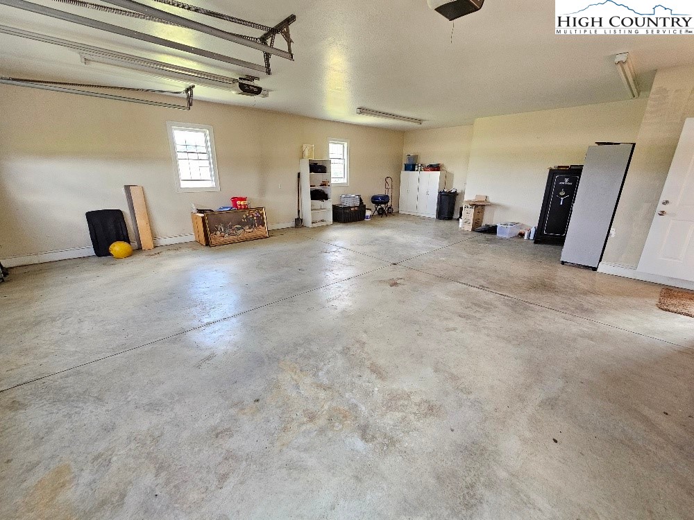 611 Barrett Road Ennice, NC 28623 - Photo 41 of 45 a view of a livingroom with furniture and a ceiling fan