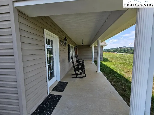 a view of a balcony with wooden floor