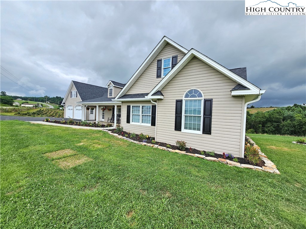 611 Barrett Road Ennice, NC 28623 - Photo 6 of 45 a view of a house with a yard and porch