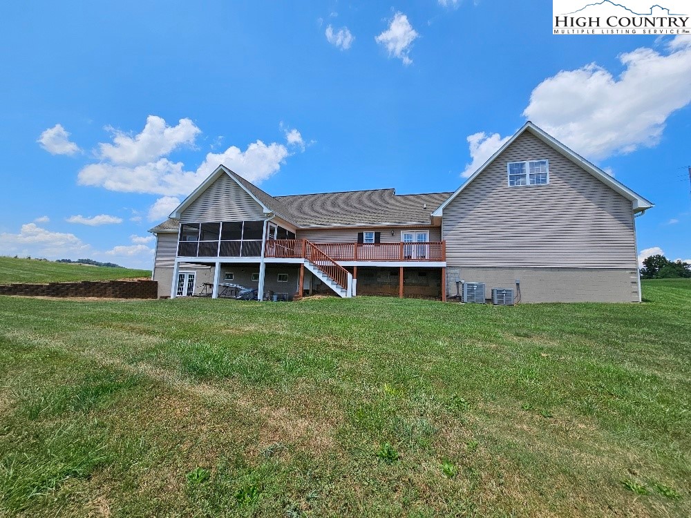 611 Barrett Road Ennice, NC 28623 - Photo 10 of 45 a front view of a house with a yard