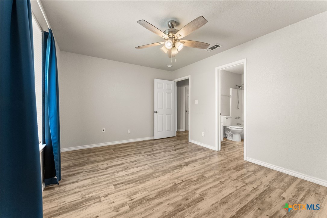 820 North 14th Street Temple, TX 76501 - Photo 12 of 23 a view of an empty room with wooden floor