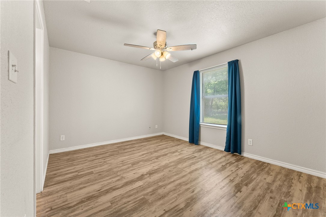 820 North 14th Street Temple, TX 76501 - Photo 13 of 23 wooden floor in an empty room with a window