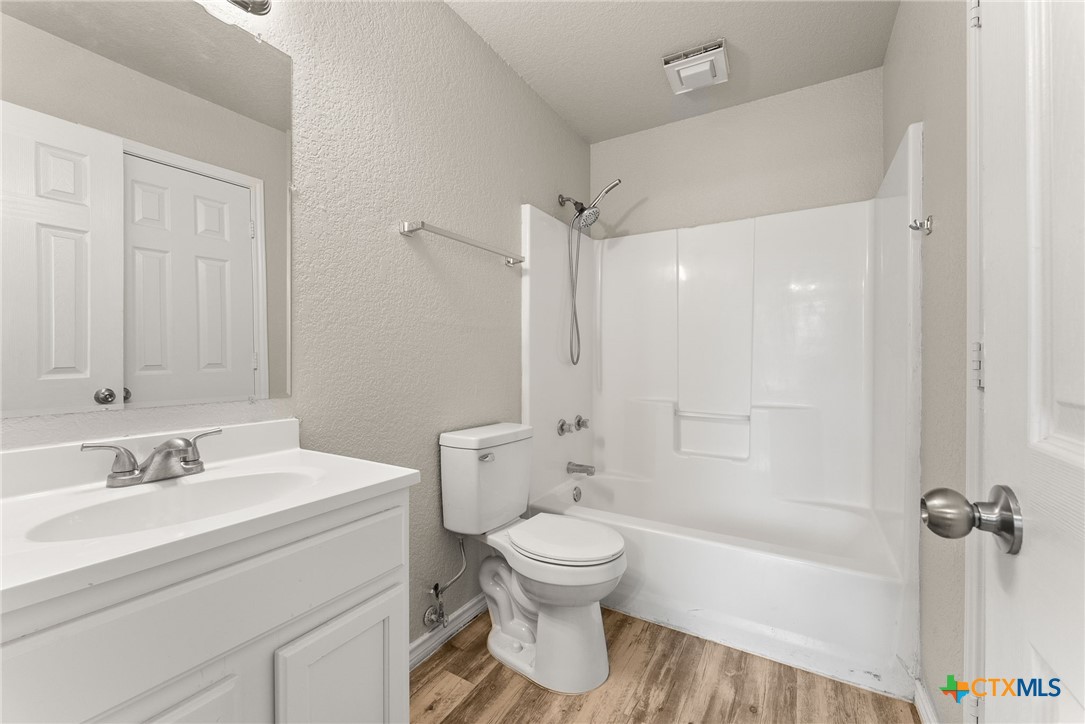 820 North 14th Street Temple, TX 76501 - Photo 14 of 23 a bathroom with a sink toilet and shower