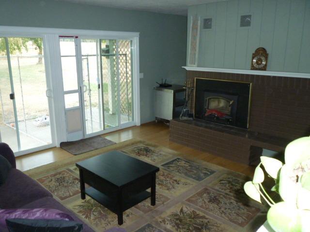 205 Latigo Ranch Road Williams, OR 97544 - Photo 13 of 50 Living room with certified wood stove and fan system
