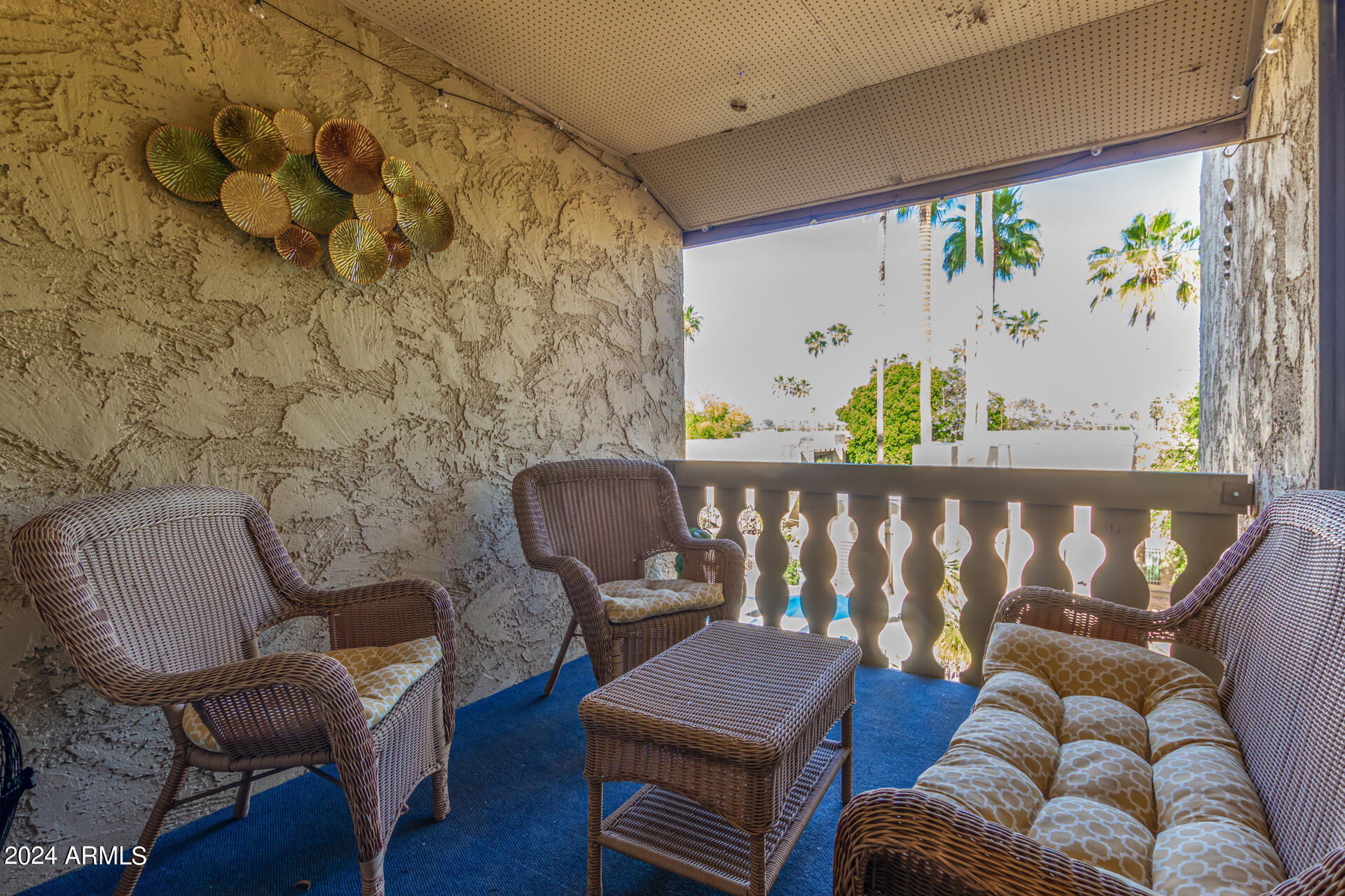 4950 North Miller Road, Unit 347 Scottsdale, AZ 85251 - Photo 17 of 31 a living room with furniture and wall paintings