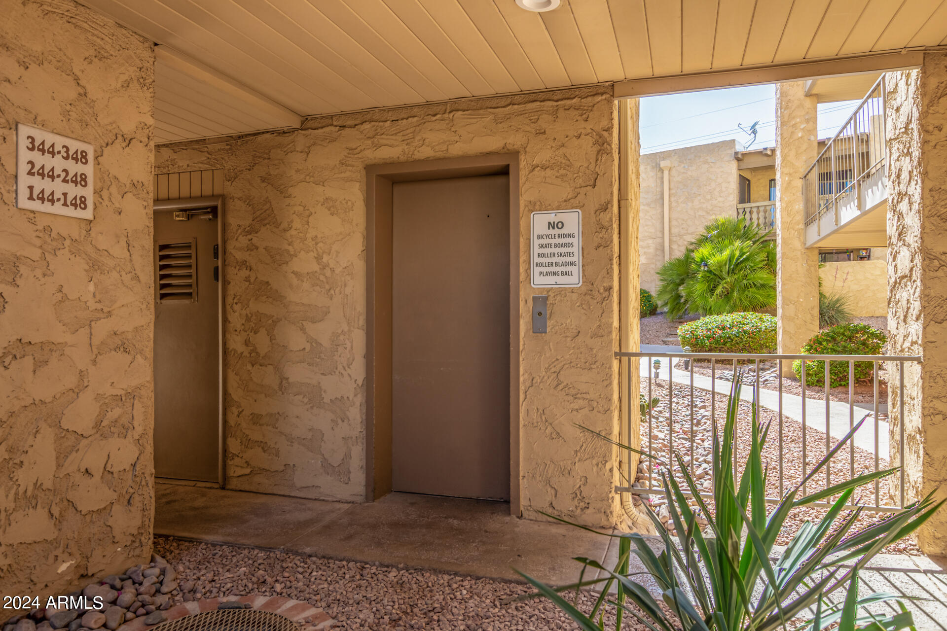4950 North Miller Road, Unit 347 Scottsdale, AZ 85251 - Photo 31 of 31 a view of a door and wooden floor
