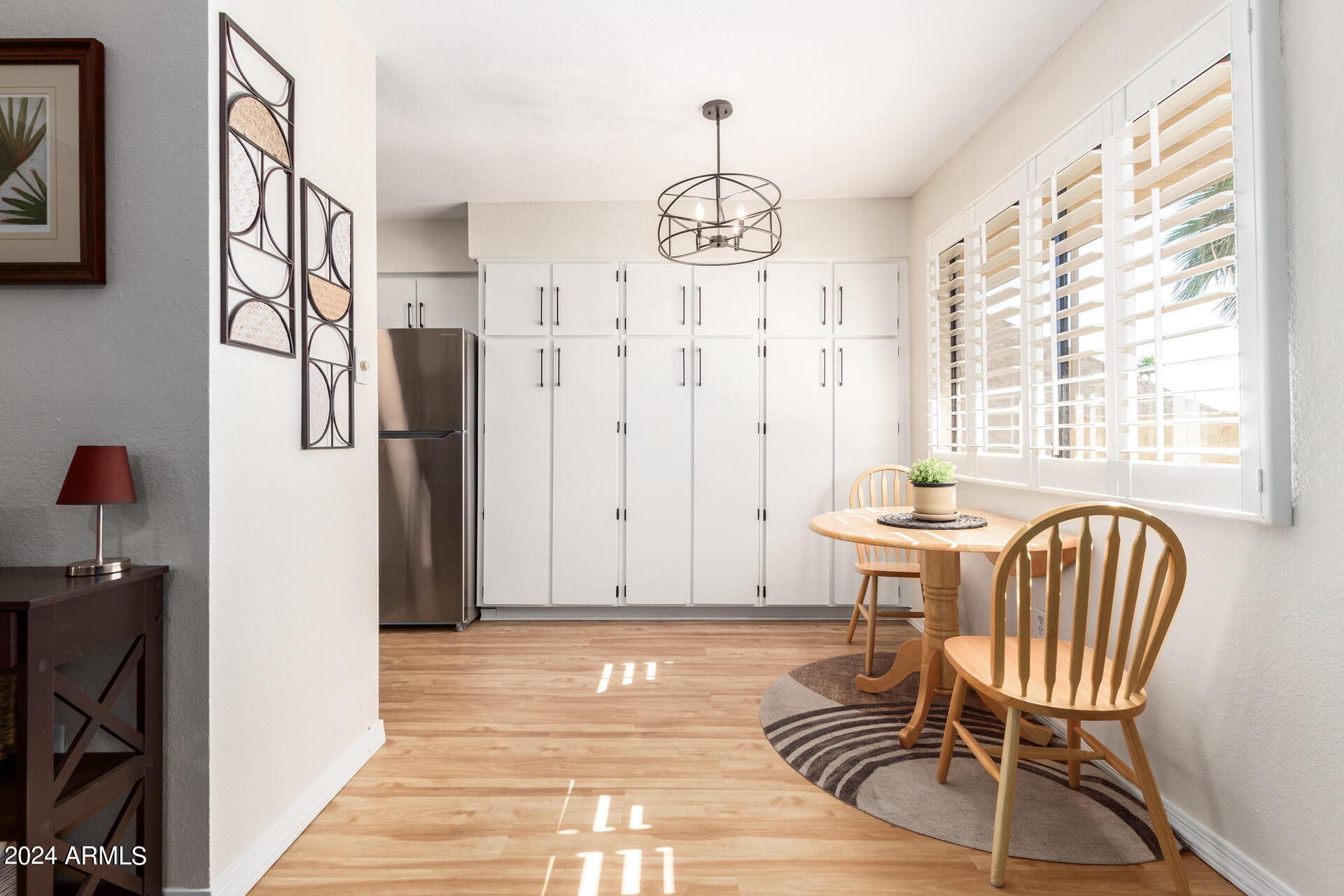 4950 North Miller Road, Unit 347 Scottsdale, AZ 85251 - Photo 5 of 31 a view of a livingroom with furniture window and wooden floor