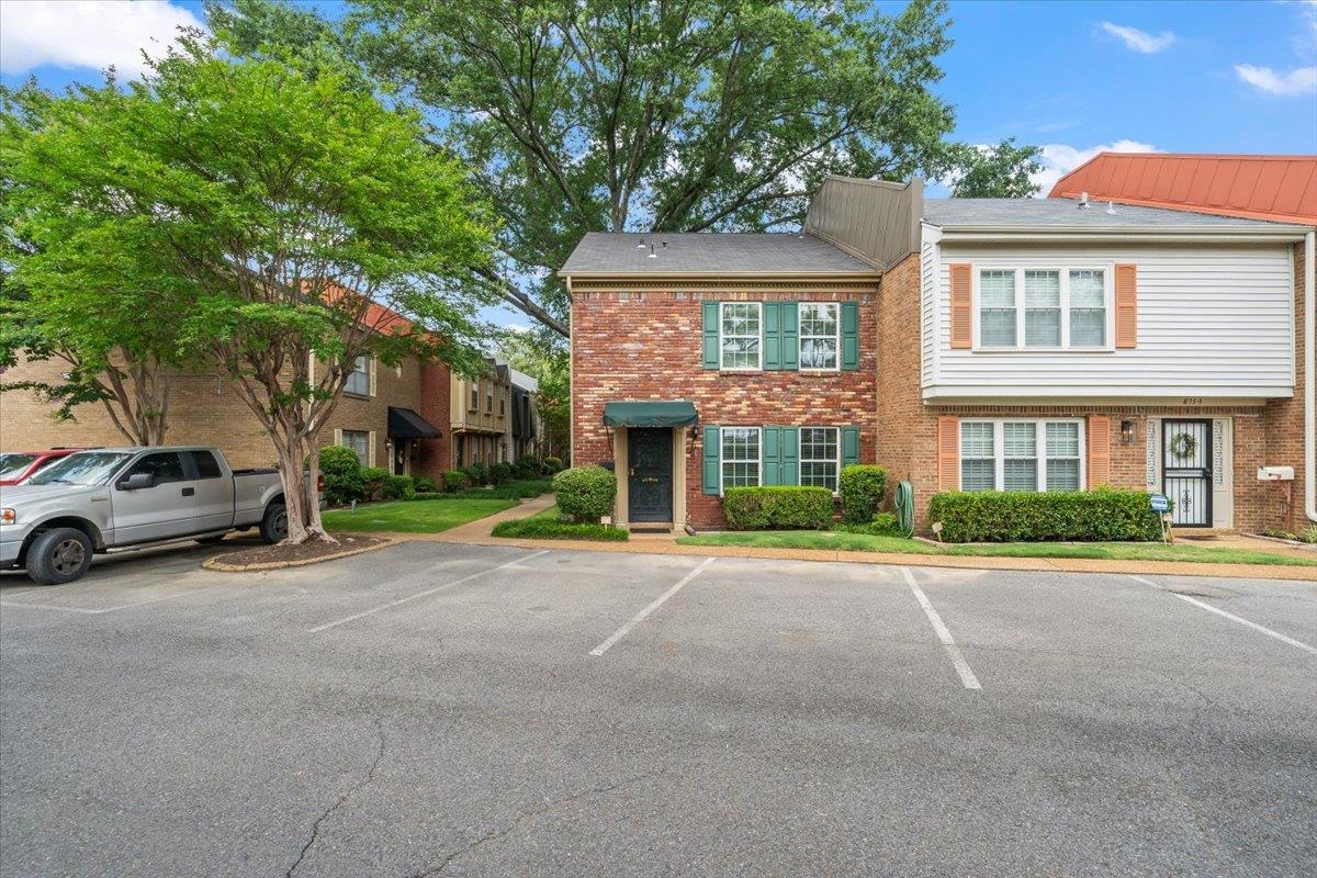 875 South Yates Road, Unit 4 Memphis, TN 38120 - Photo 5 of 25 Townhome / multi-family property with brick siding and uncovered parking